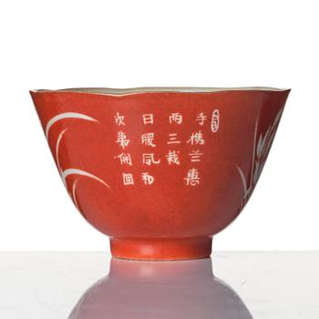 A coral-ground reserve decorated 'orchids' cup, late Qing dynasty.