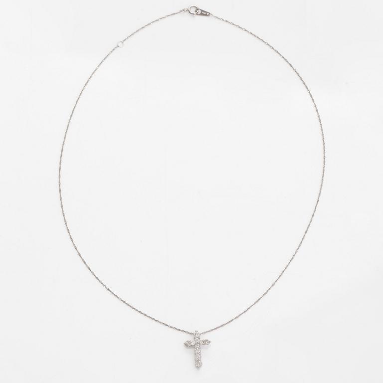 A platinum necklace with a cross pendant set with brilliant-cut diamonds 0.52 ct acording to engraving.