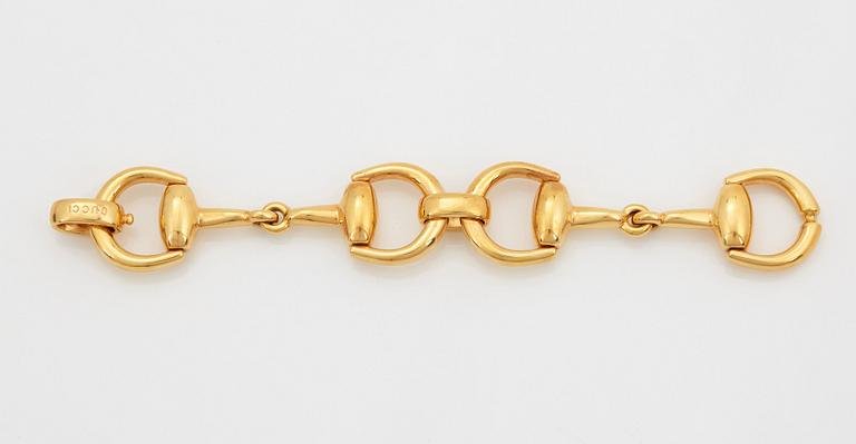 An 18K gold Gucci bracelet.