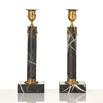 A pair of Gustavian black marble candlesticks.
