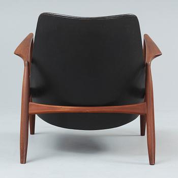 An Ib Kofod Larsen 'Sälen' teak and black leather armchair, OPE, Jönköping, Sweden 1950's-60's.