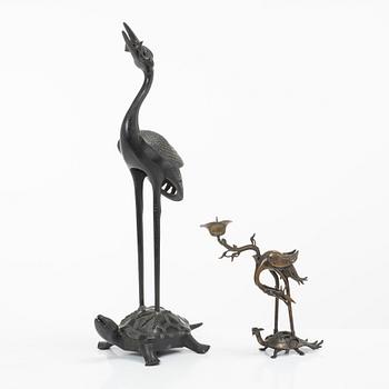Two bronze sculptures/candle holders, Japan & China, 20th century.