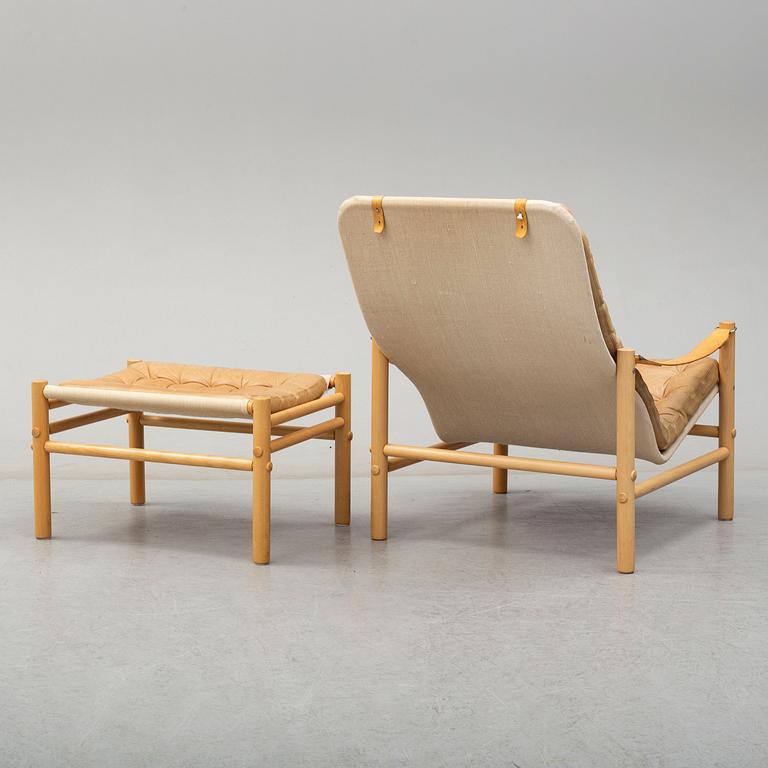 BROR BOIJE, a 'Junker' leather covered easy chair and ottoman from Dux.