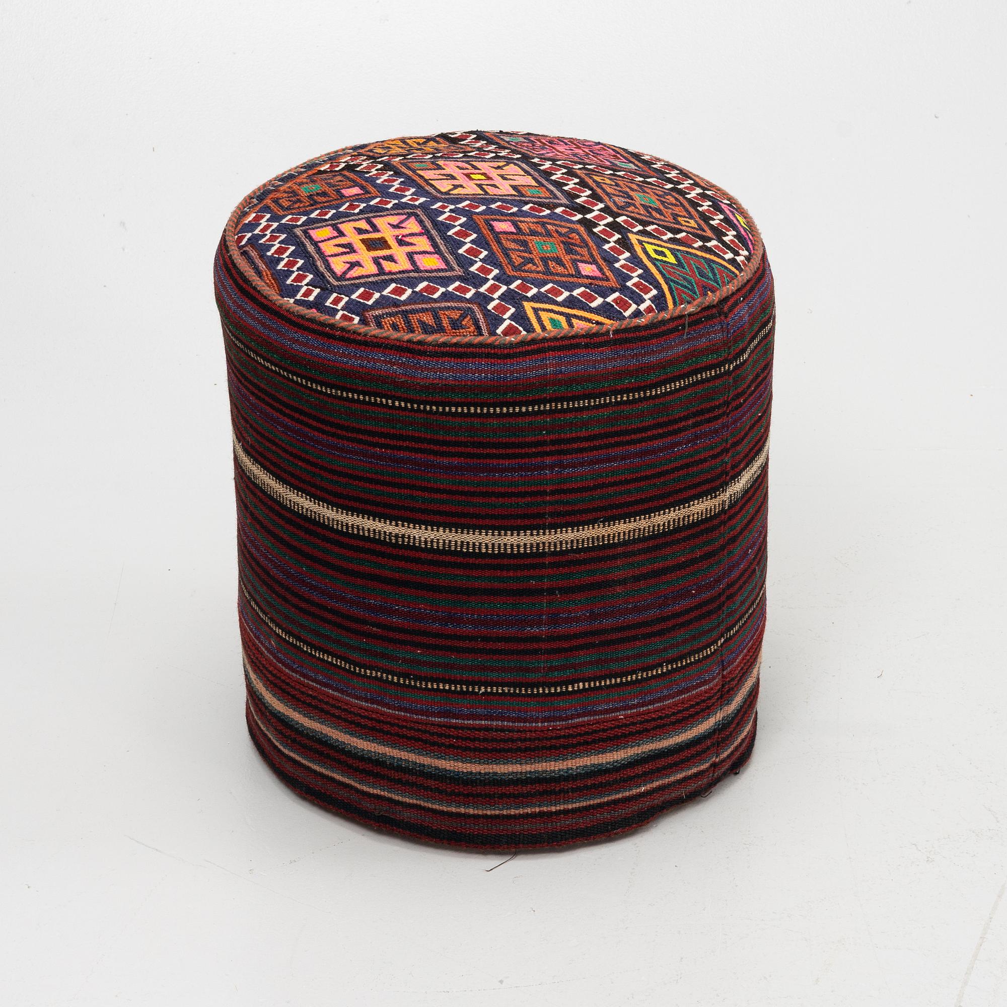 A Kelim covered stool.