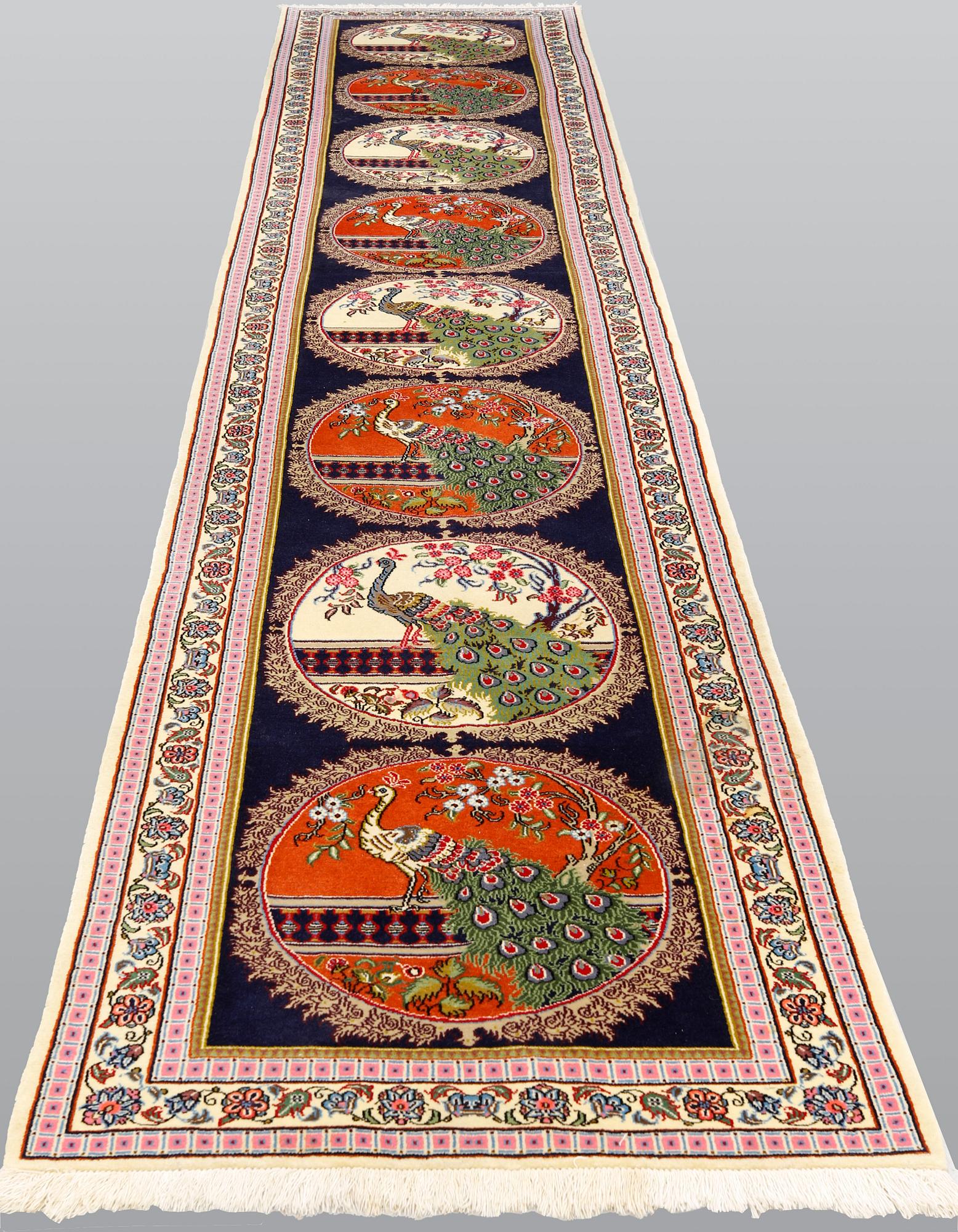 A pictorial Qum runner, ca 424 x 83 cm.