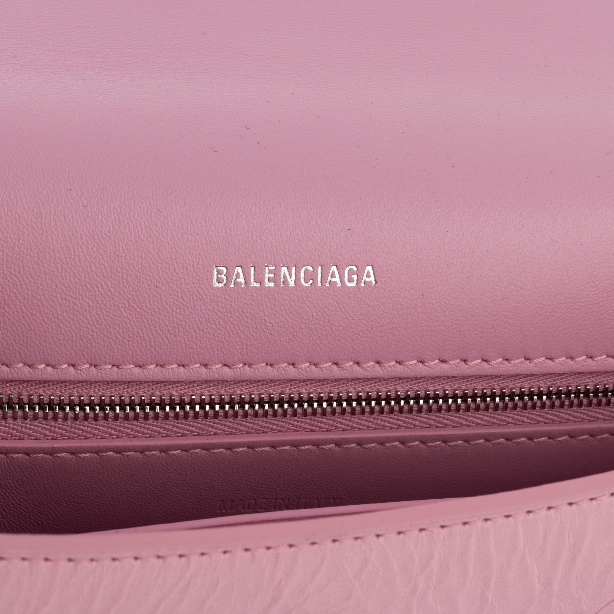 Balenciaga, a pink leather 'Downtown' bag.