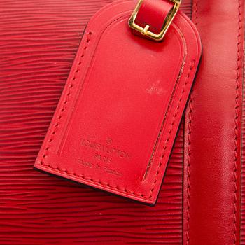 Louis Vuitton, A Red Epi Leather Keepall travel bag.