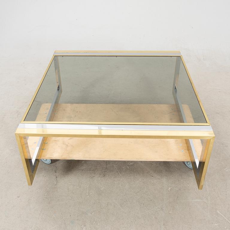 A glass and metal coffee table from Romeo Rega second half of the 20th century.