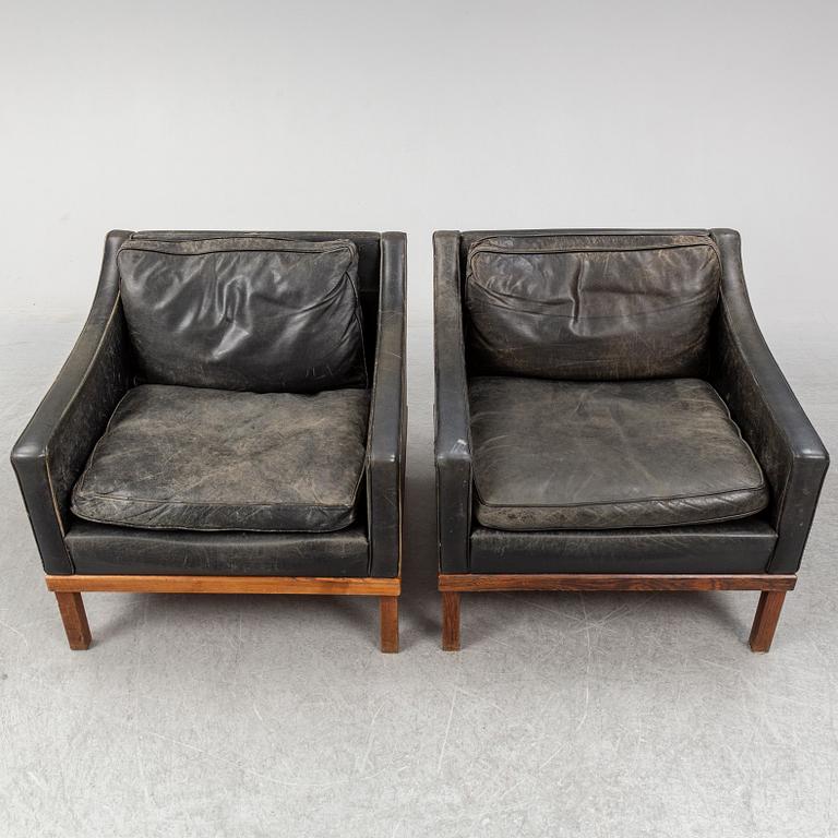 A pair of "The President" black leather armchairs by Ingemar Thillmark for OPE-möbler, Sweden.