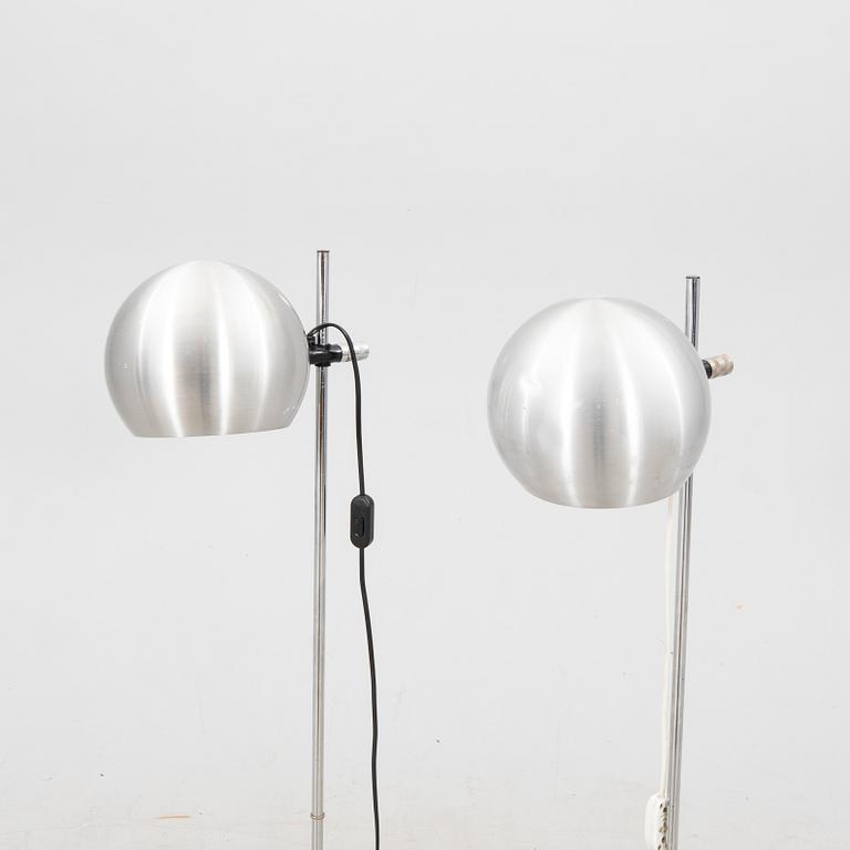 A pair of Heimi steel 1970s floor lamps.