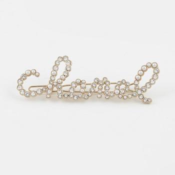 Chanel, a rhinestone hairpin, 2019.