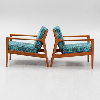 Folke Ohlsson, a pair of 'USA 75' armchairs, Dux, Sweden, 1960's.