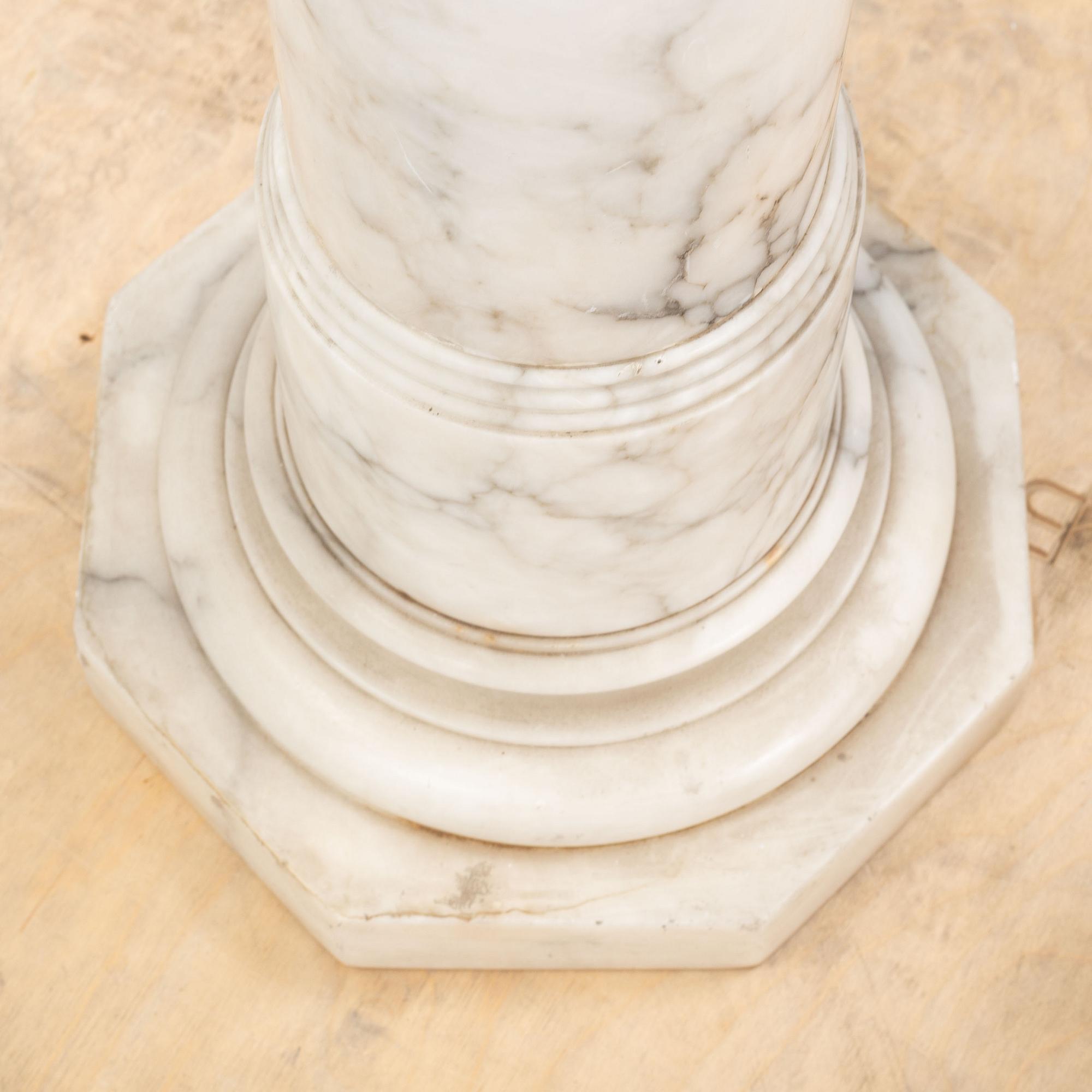 A marble pedestal, early 20th Century.