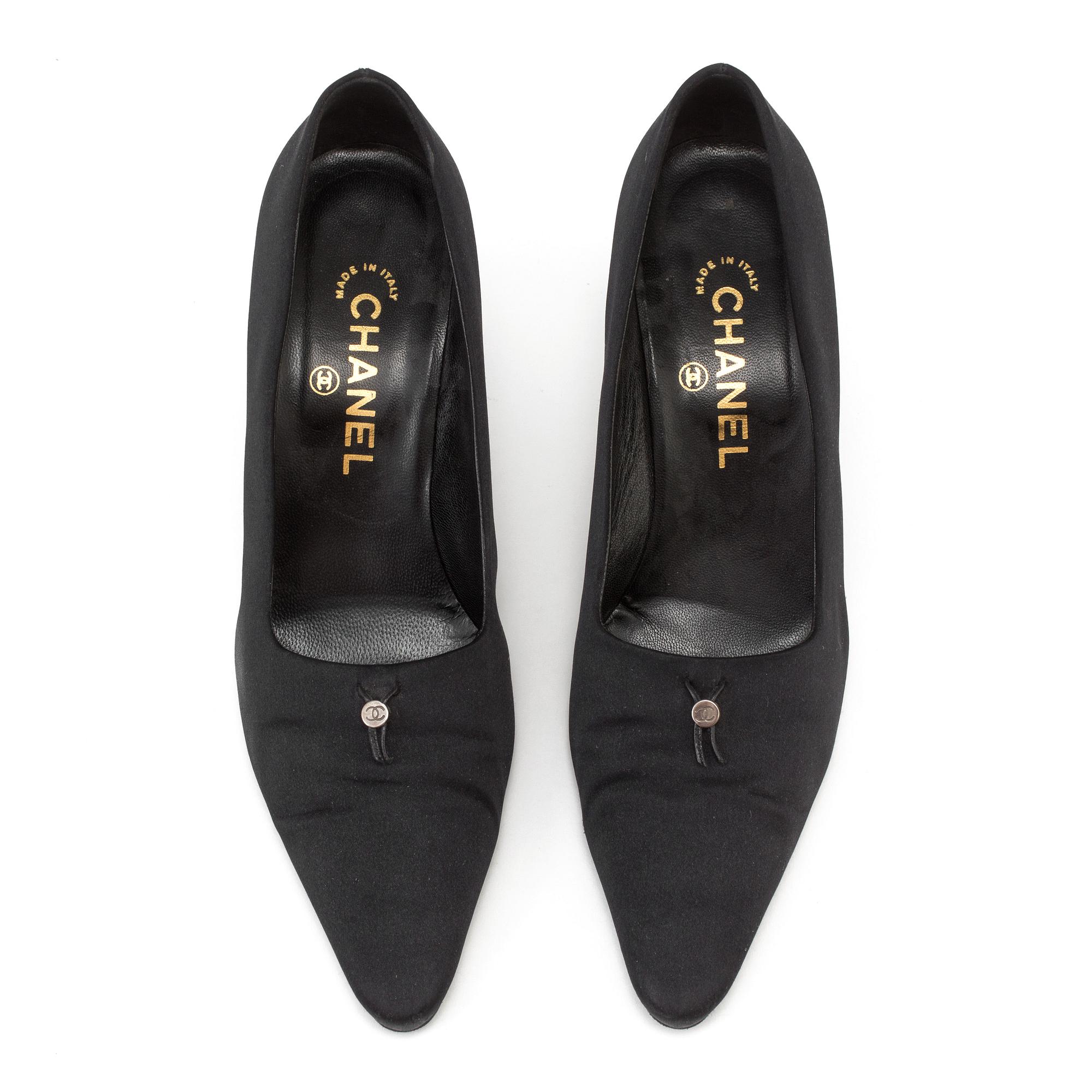 Pumps by Chanel.