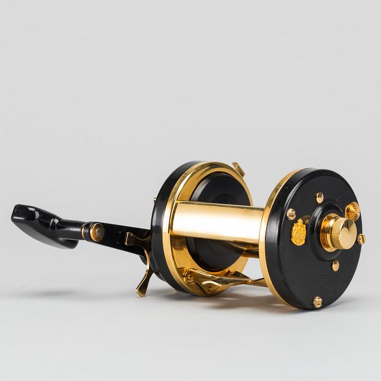 A guilded Ambassadeur 10000C De Luxe REEL BY ABU, SWEDEN. 1990.