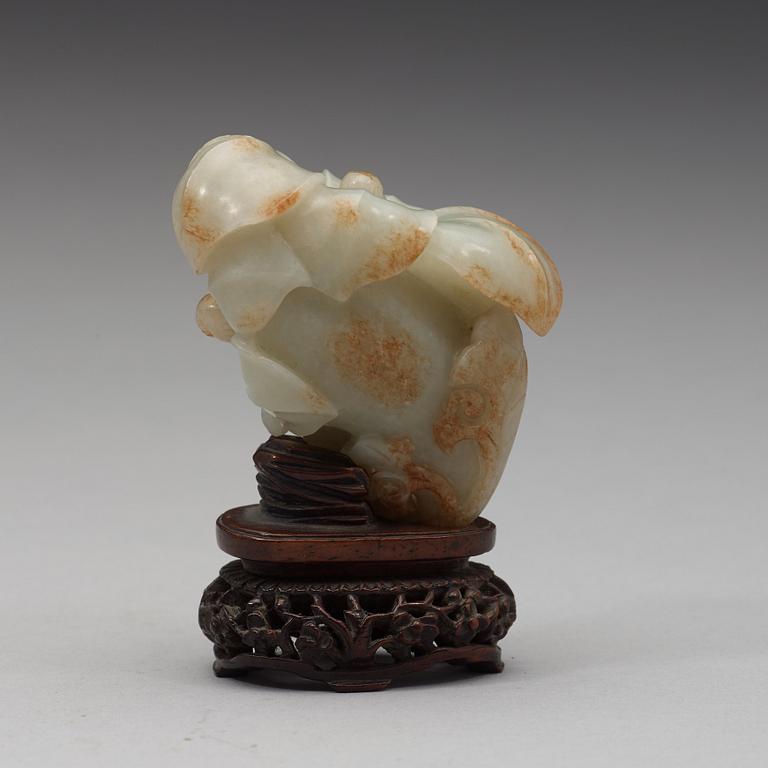A celadon nephrite floral group, Qing dynasty (1644-1944).