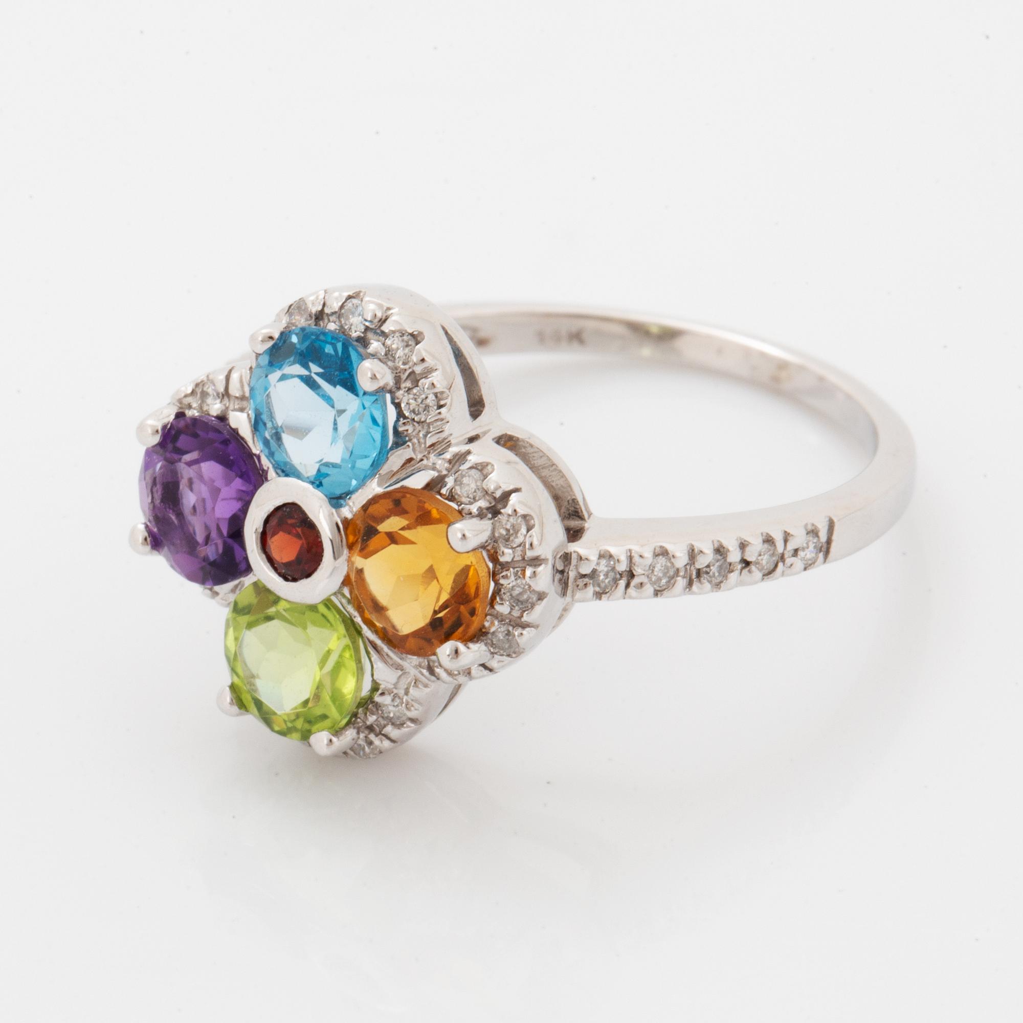 Ring, med fasettslipad topas, ametist, peridot, citrin och briljantslipade diamanter i form av blomma.