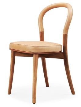 24. An Erik Gunnar Asplund walnut and beige leather 'Göteborg' chair, by Cassina, Italy.