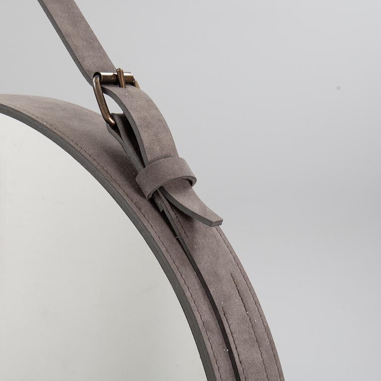 A mirror "Adnet" with leather hanging in original box, designed 1950 by Jacques Adnet for Gubi, Denmark.