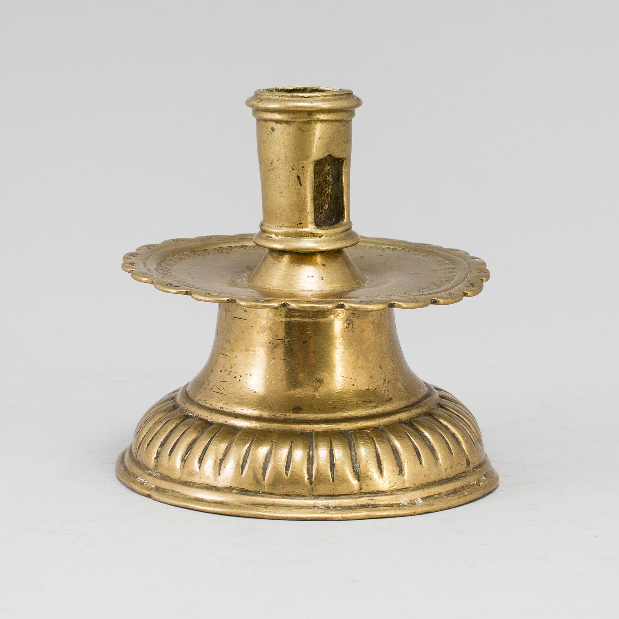 A 16th century bronze candlestick.