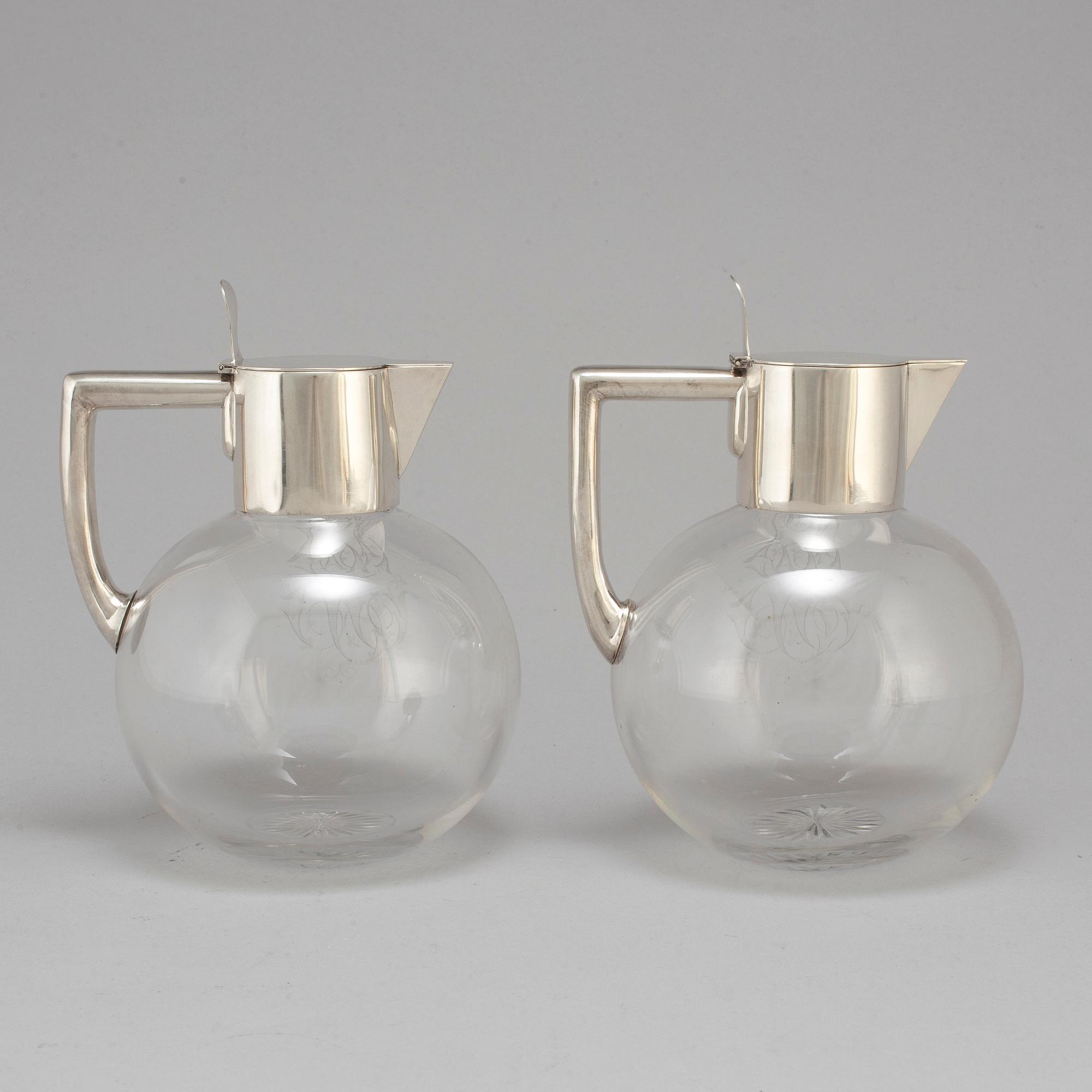 A pair of caraffes with silver mountings by CG Hallberg, Stockholm 1890.