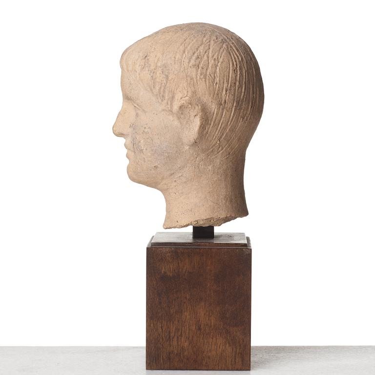 A terracotta sculpture of a young man, probably, 3rd Century B.C, Etruscan.