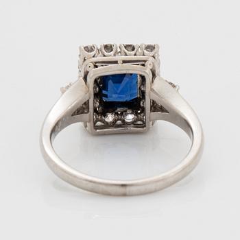 A platinum ring set with a faceted sapphire.