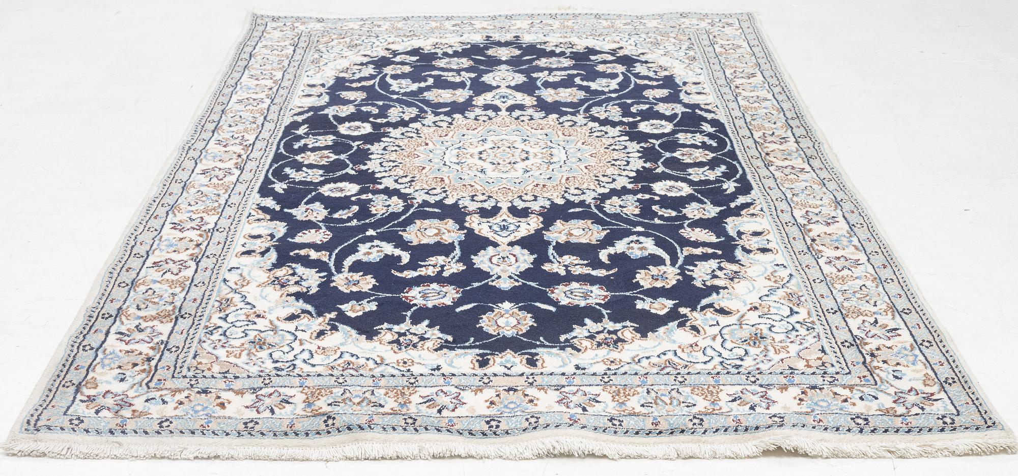 A Nain carpet, c. 255 x 150 cm.