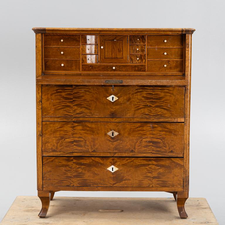 A birch-veneered dresser, second half of the 19th century.