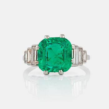 1207. A cushion-shape mixed cut Colombian emerald, 4.56 cts, and baguette-cut diamond ring.