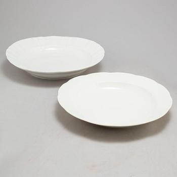 A set of three odd Berlin serving dishes, a set of two bowls and a dish and a figurine, 19th and 20th Century.