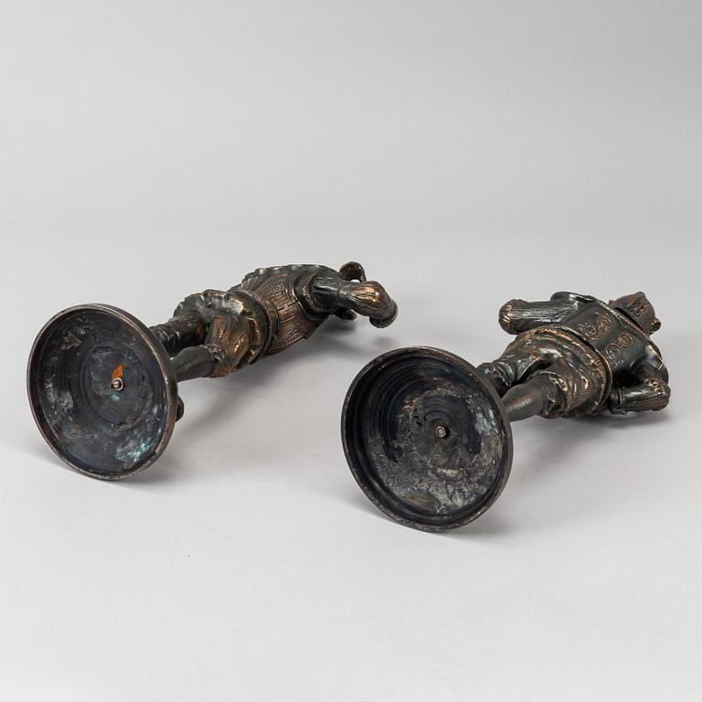 A pair of decorative metal sculptures, circa 1900.