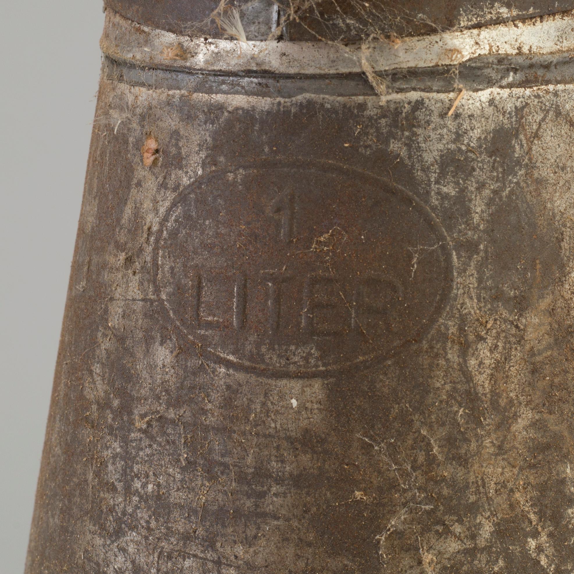 Six tin oil jugs, first half of the 20th Century.