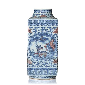 An underglaze blue and copper-red 'crane and deer' cong vase, Qing dynasty, 18/19th century.