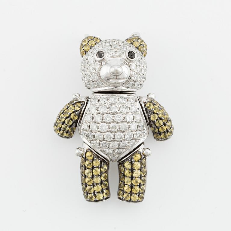 Pendant in the shape of a teddy bear, 18K white gold with brilliant-cut diamonds and presumably yellow sapphires.