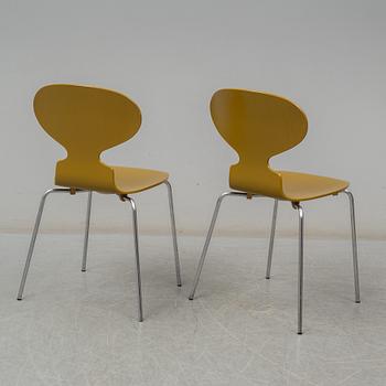 BRUNO MATHSSON & PIET HEIN, and ARNE JACOBSEN, a 'Supercirkel' table and two 'Myran' chairs, from Fritz Hansen.