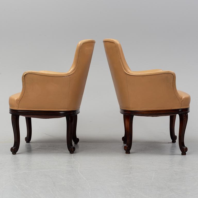 A pair of leather opholstered lounge chairs from 1927, Nordiska Kompaniet.