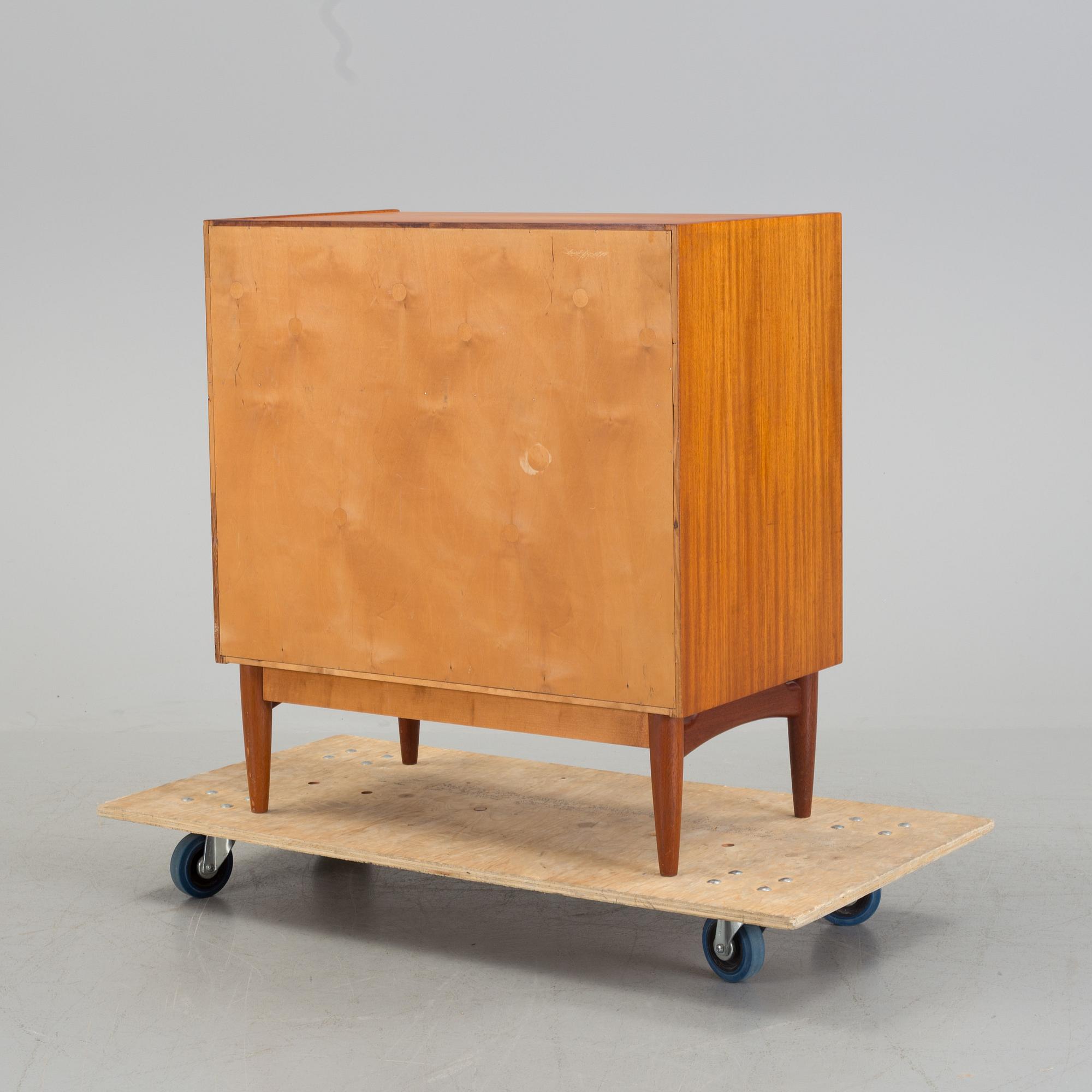 A mid 20th century teak dressing commode.