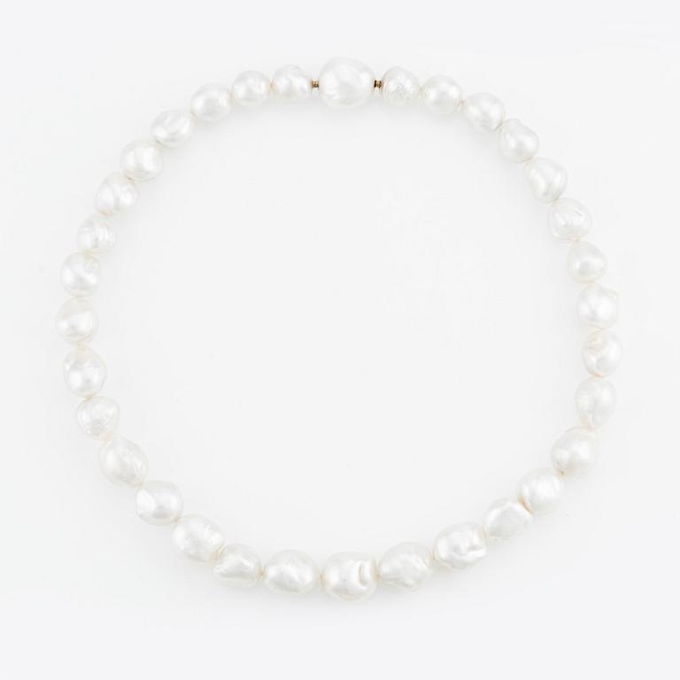 A Gaudy necklace with cultured South Sea pearls, a platinum bracelet, and two clasps.