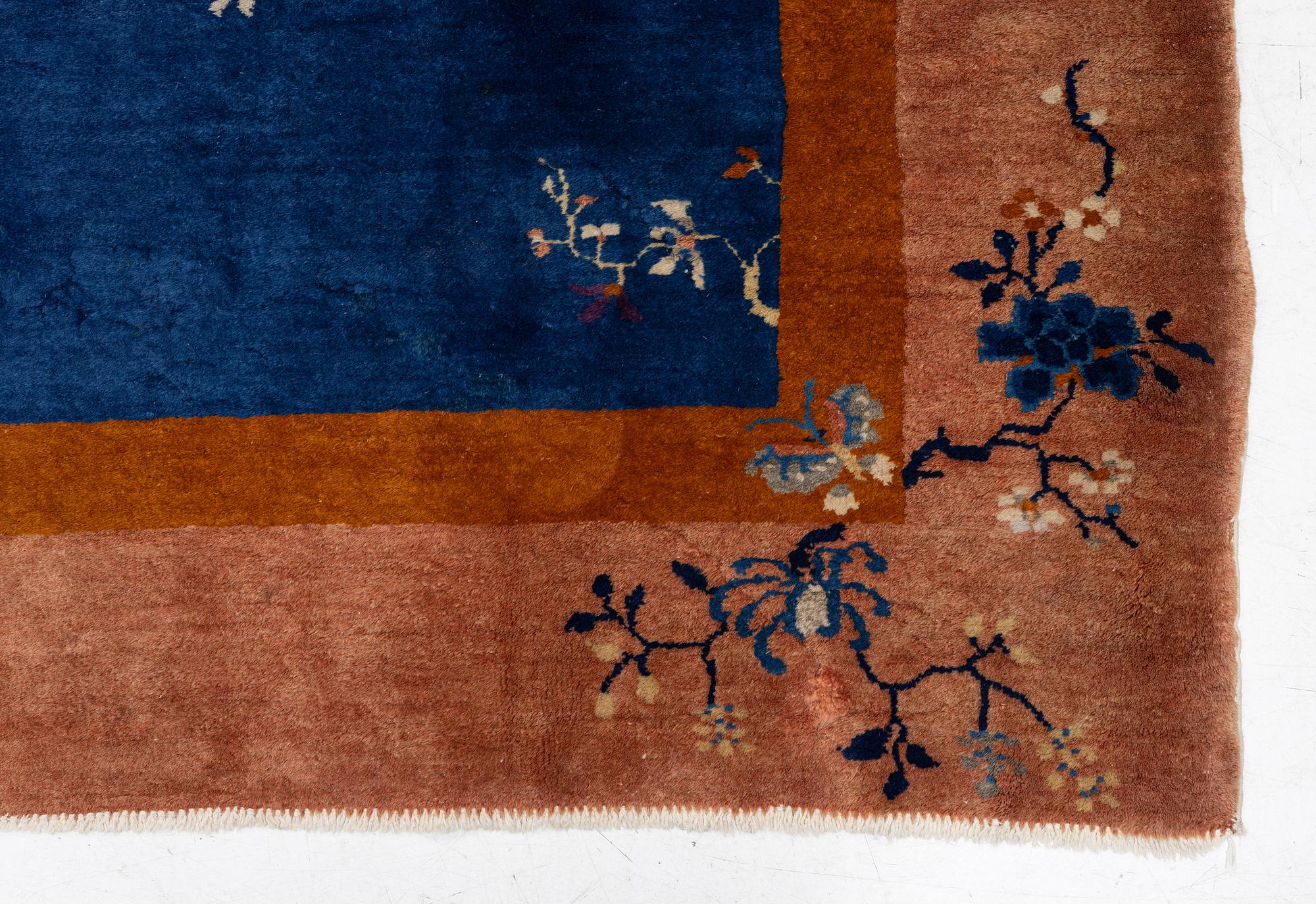 A Chinese art deco carpet, c. 327 x 278 cm.