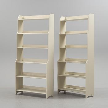 A pair of IKEA "Leksvik" painted bookcases.