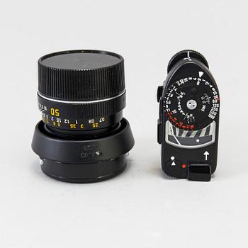 a black body Leica M4-P camera with no 1605951 made by Leitz Canada in 1982. With two lenses and a Leica Meter.