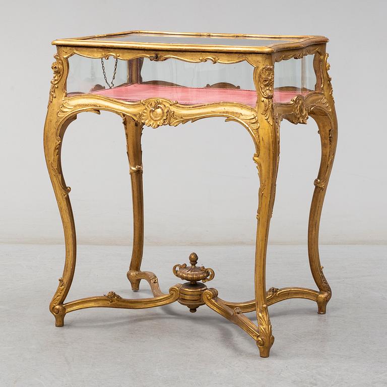 A Louis XV style display table, first half of the 20th century.