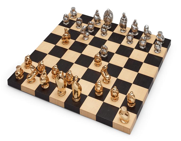 A set of chess; 32 pewter and pacel gilt pewter,  by Svensk Tenn.