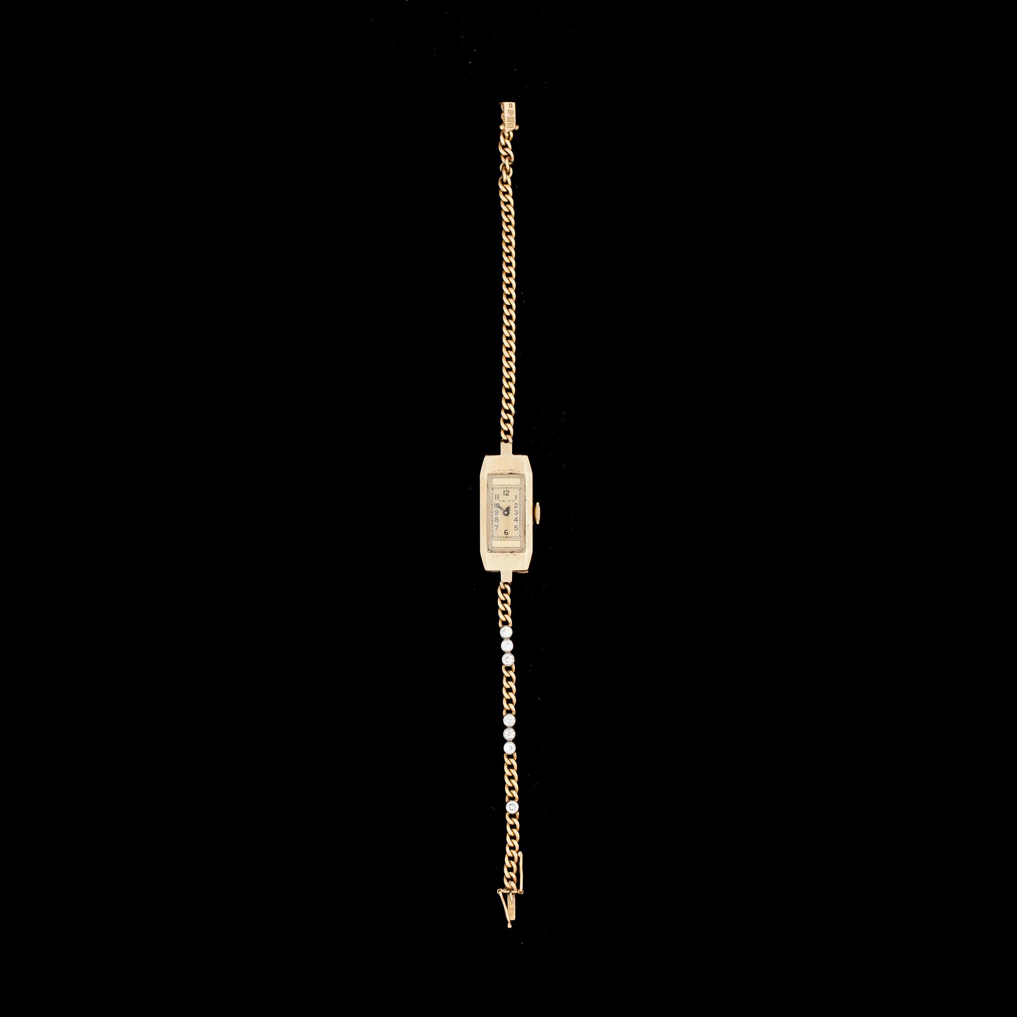 DAMARMBANDSUR, 18k guld, länk besatt med briljant- och antikslipade diamanter, ca 0,21 ct. 1940-tal. Total vikt ca 16 g.