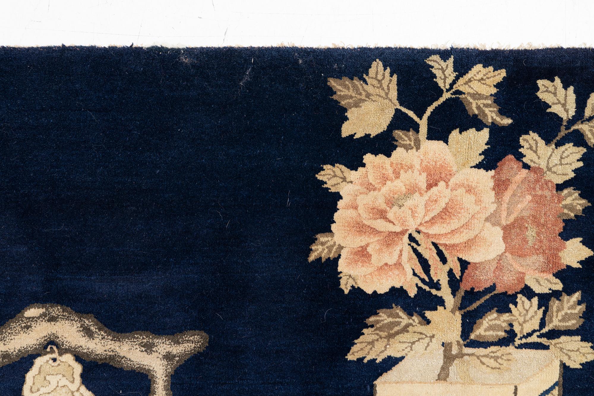 A semi-antique Baotou rug, approx. 185 x 122 cm.