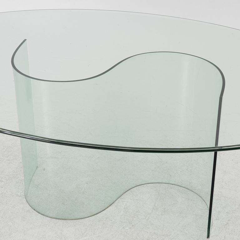 A dining table, glass, contemporary.