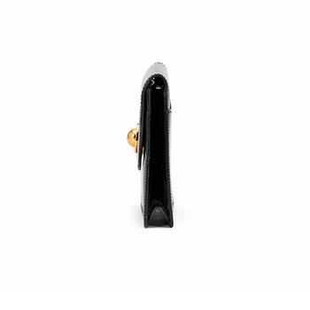 CÉLINE, a black patent leather bag.