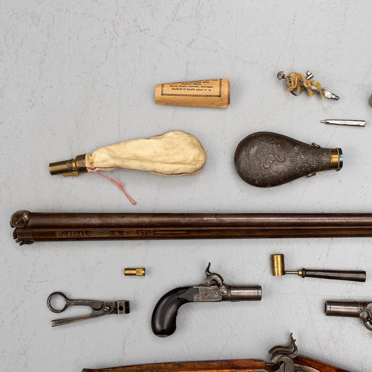 A cased double barreled percussion shotgun marked Gosset a Paris and a pair of percussion pistols marked Fni PAR LEPAGE.