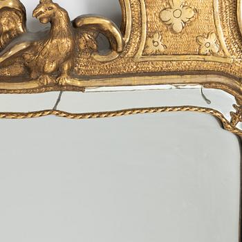 A giltwood rococo mirror, later part of the 18th century.